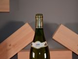 a bottle of wine that is sitting on a table