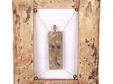 an old wooden frame with a small piece of wood in it