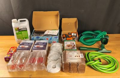 a lot of gardening supplies on a wooden table
