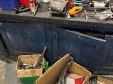 a box of tools sitting on a workbench in a garage