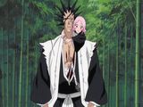 a man with pink hair standing in front of a bamboo forest