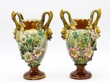 two vases that have been painted with flowers on them