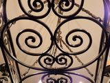 a close up of a chandelier hanging from a ceiling in a room