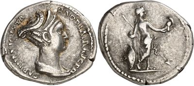 a silver coin with an image of a woman holding a bird