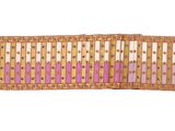 an image of a wicker bench with a pink and yellow stripe