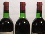 three bottles of wine sitting next to each other on a table