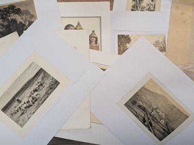 a lot of old photos on the table