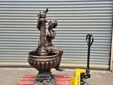 a statue sitting on a pallet next to a fork