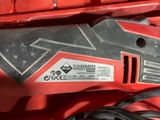 an image of a corded electric tool in a red box