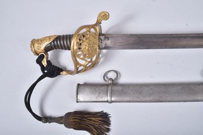 a sword with a gold handle and a tassel on it