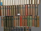 books stacked on top of each other on a shelf