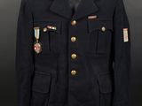 a military jacket with medals on the collar and buttons