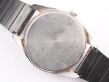 an image of a close up of a wrist watch on a white surface