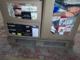 a trash can with many items in it sitting on a pallet