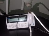 a cell phone that is connected to a charger on a chair
