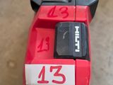 a picture of a red and black machine with a number on it