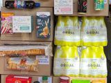 many boxes of food that are stacked on top of each other
