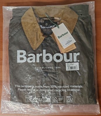 a bag of barbour clothing sitting on a table