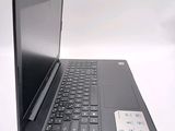 a black laptop with a black keyboard on a white surface
