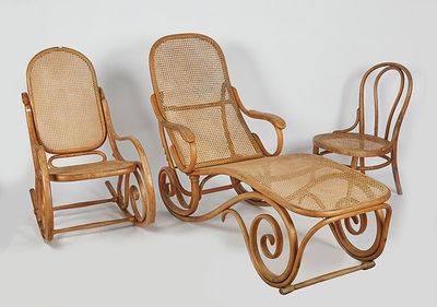 three wicker chairs and a footstok on a white background