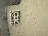 a picture of a close up of a plate with a tag on it