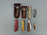 a lot of different types of knives on the table