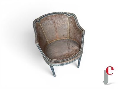 a wicker chair that is sitting on a white surface