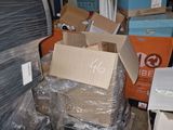 a pile of boxes sitting on top of a pallet in a warehouse