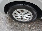 a close up of a car ' s tire on the pavement