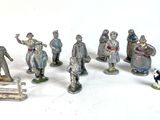 many figurines of people that are standing together
