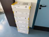 a stack of boxes sitting on the floor next to a door