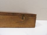 a small wooden box that has a lock on it