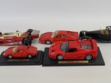 four different models of cars on display on a table