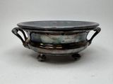 silver plated bowl with handles and handles on a white surface