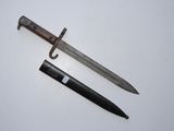 an old knife and a small knife on a white surface