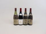 trois bouteilles de vin sont alignées sur une surface blanche