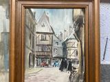 une photo d'un tableau représentant une scène de rue, dans un cadre
