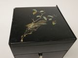 an image of a small black box with a bird on it