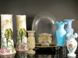 many vases that are sitting on a table