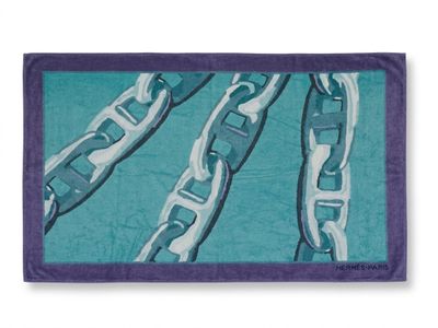 purple and teal beach towel with a picture of a chain link