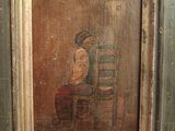 an old painting of a man sitting in a chair with a hat on