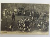 a black and white photo of a crowd of people in a park