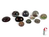 a lot of stones that are sitting on a white surface