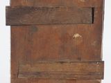 an old wooden box with a piece of wood sticking out of it