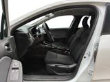 the interior of a car with the door open and the driver ' s seat down