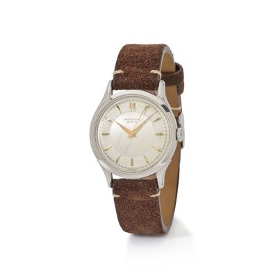 a close up of a watch on a white background with a brown strap
