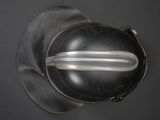 an overhead view of a helmet on a black surface