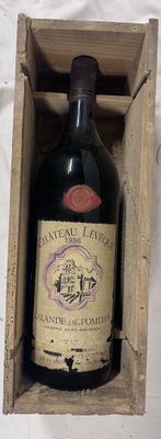 a bottle of wine in a wooden box on a table