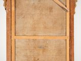 an old wooden frame with a picture hanging on the wall