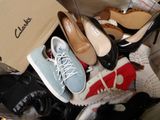 many pairs of shoes that are sitting in a box